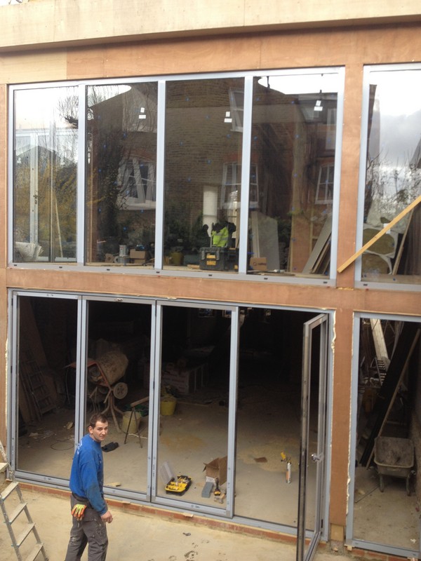 Aluminium bi-fold doors with two-storey glazing in High Wycombe