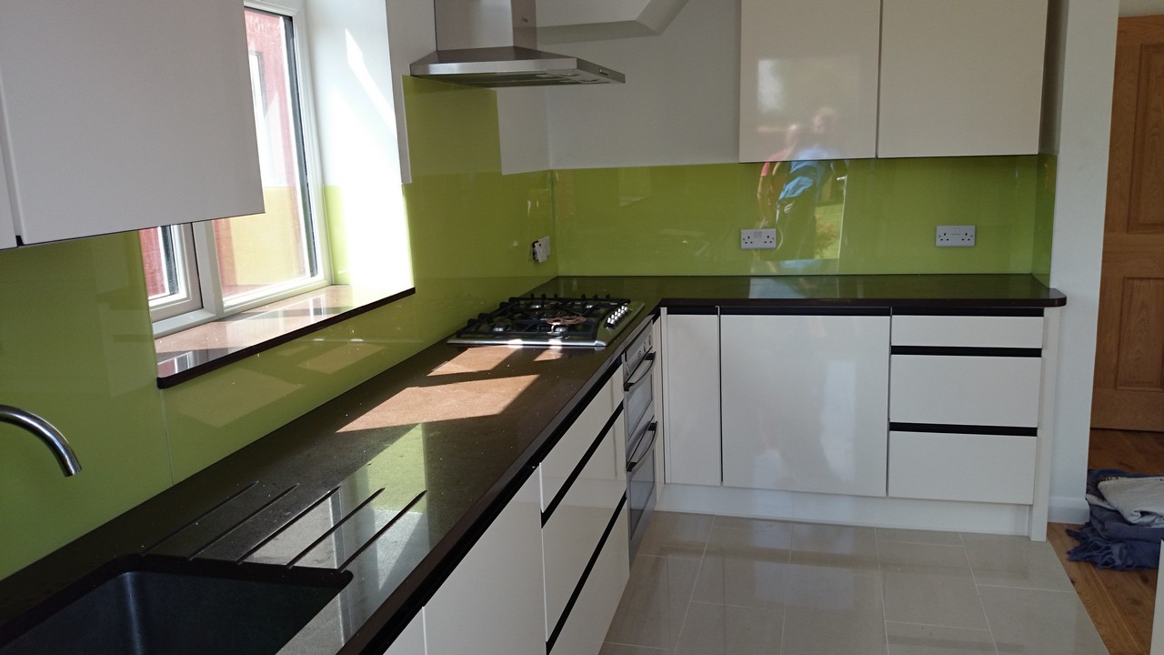 Lime green glass kitchen splashback installed by High Wycombe glaziers